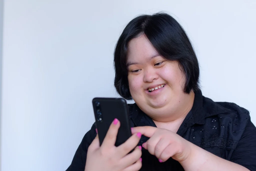 Disabled woman using mobile phone to make a call